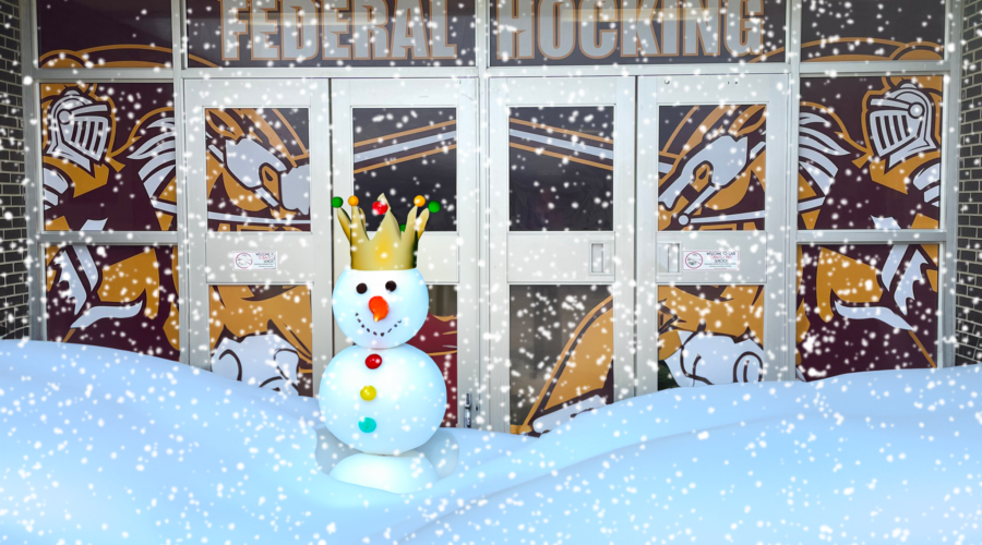 FedHock front door covered with snow. A King Snowman is in front.